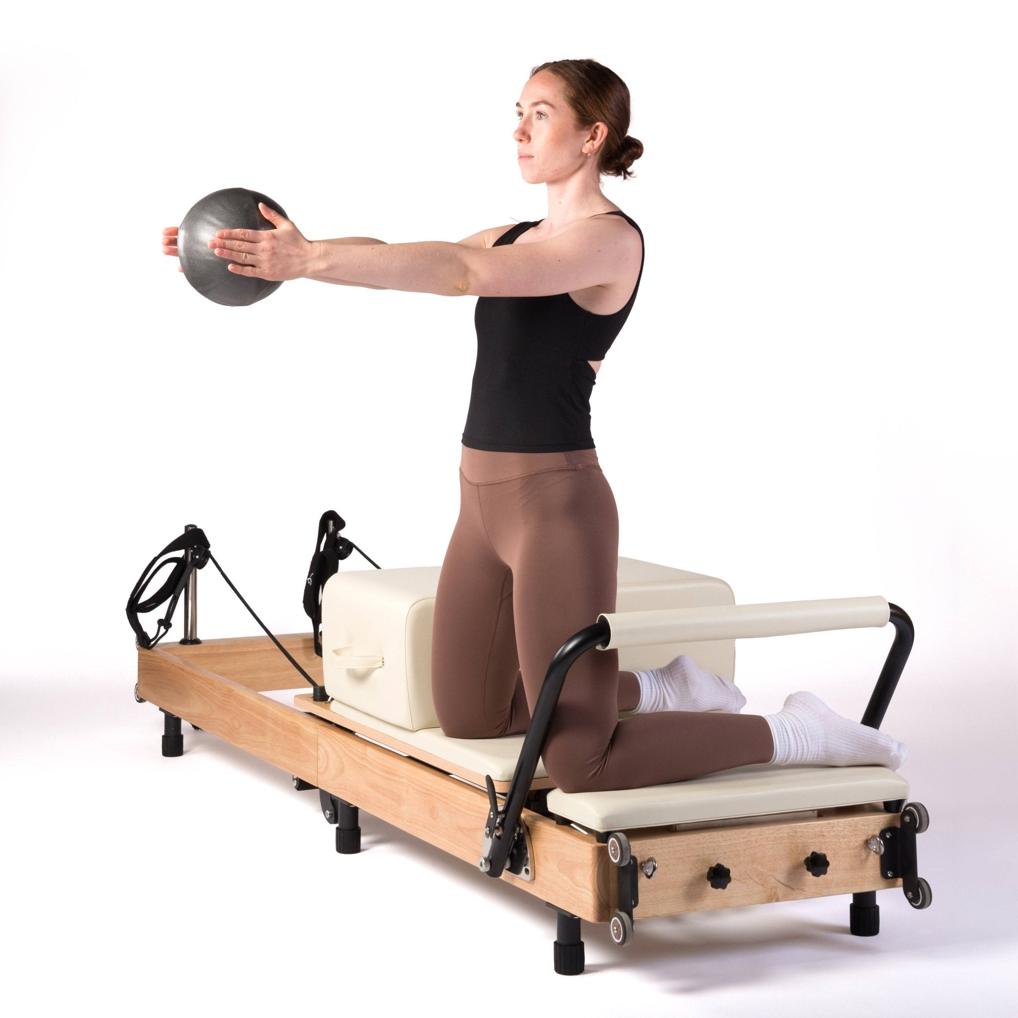 esercizi di pilates reformer con palla