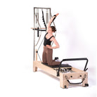 esercizi pilates reformer con torre