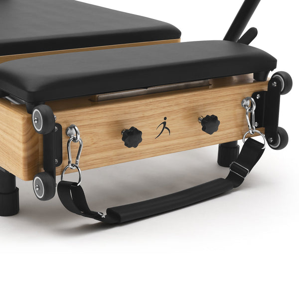 Reformer Pilates pieghevole Flexi, legno naturale, rivestimento nero – maniglie e ruote
